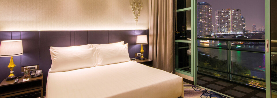 Grand-Zimmerbeispiel mit Flussblick des Chatrium Hotel Riverside Bangkok